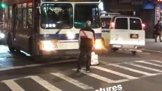 Man stands in front of b38 bus