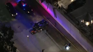 LA Police Chase, Vigilante Joins, Drives Off Parking Deck... Flipped