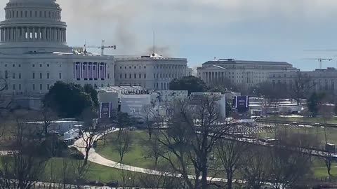 Smoke behind Capitol. People Running from the inauguration stage