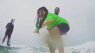 Father surfing daughter falls off