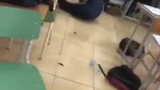 Kid sleeping in class gets chair leg kicked by friend, chair breaks and kid falls