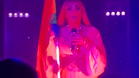 A Russian drag-queen with a rainbow flag, in a gay club in Yekaterinburg, Russia