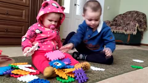 Cute_Baby_Playing_with_Her_Older_Brother
