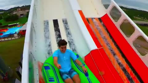 Racing on the world's first ever Blasterango Battle water slide!