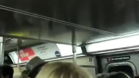 Group of people on subway sing lean on me