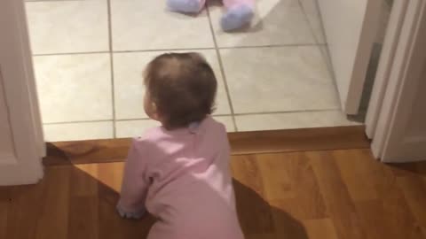 Identical twin baby girls crawl and chase each other for the first time