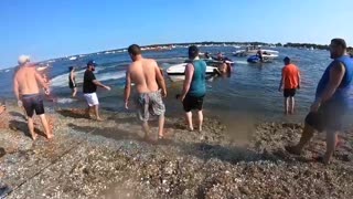 Beach Goers Band Together to Save a Boat