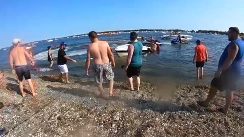 Beach Goers Band Together to Save a Boat