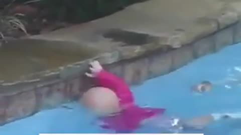 cute baby learning to swim.