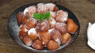 Add yoghurt to flour and make this yummy mini doughnuts.