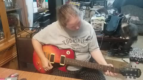 Connie Trying Out Her Les Paul Guitar