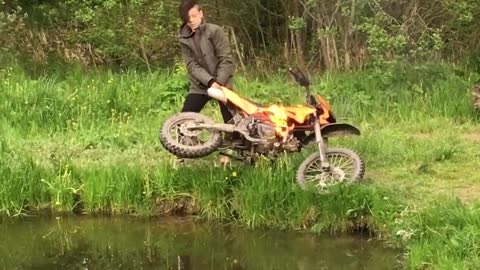 Boy Throws Flaming Dirt Bike into Lake and Retrieves it