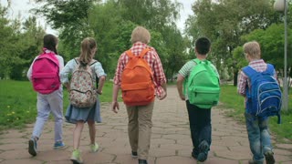 Kids Walking to School With Heavy Backpacks