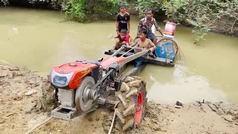 Driver tractor go transport water at the river part 2