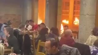 French Diners Eat Peacefully While Streets Burn