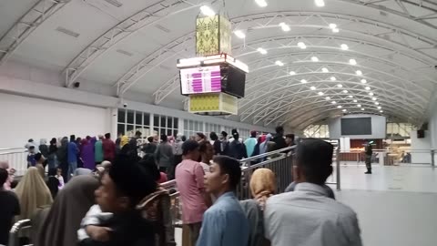 Atmosphere at Lombok Airport , Indonesia when pickingbup family from outside island.