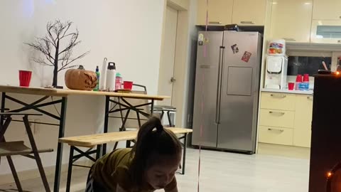 Daughter Uses Stool to Reach Her Balloon