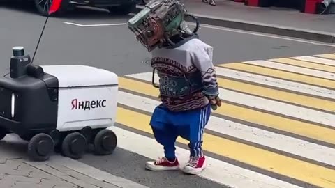 Gopnik robot takes another robot across the street in Moscow. 👀