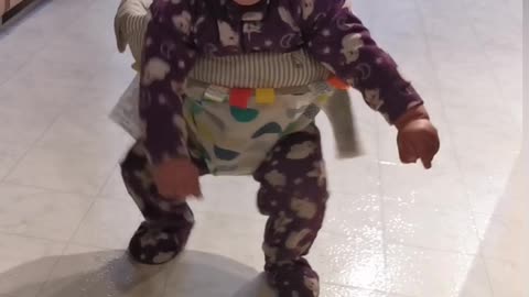 Funny baby jamming in her jumper