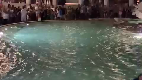 Swimming in the Trevi Fountain in Rome