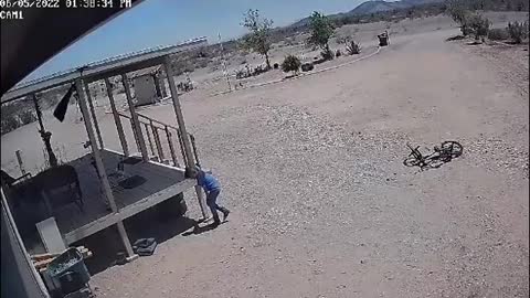 Kid Riding His Bike Gets Caught in Dust Devil