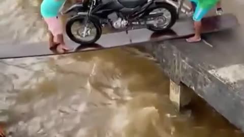Funny pushing a motorcycle in to a boat gone wrong. (Cute Video)