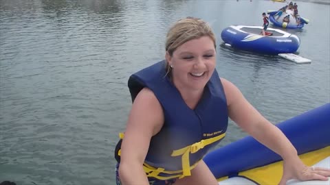 Woman falls off Inflatible climbing wall