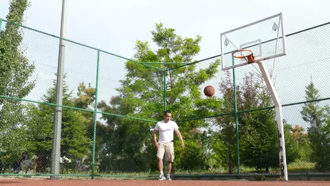 The Man Practicing Basketball Shot