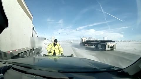 Semi-Truck Nearly Claims A Highway Patrol Officer's Life On Snowy Interstate