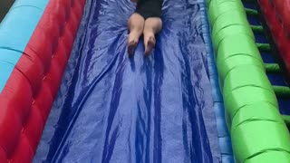 Woman Gets Bounced Off of Slippery Slide