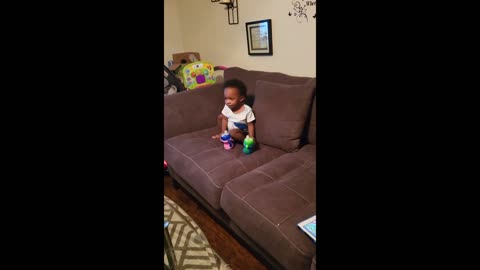 Sneaky toddler steals milk bottles from the fridge