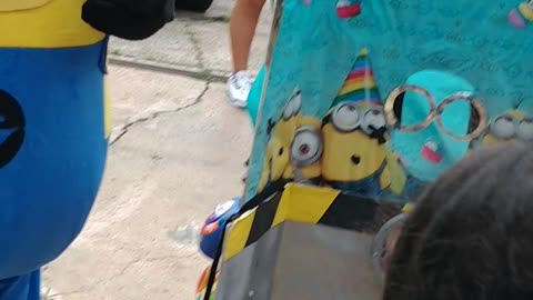 Houston mascot party character yellow helper minion plays banana peel & antidote game at birthday