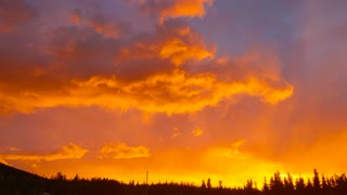 Amazing Alaskan Midnight sunset with alpine glow and a rainbow