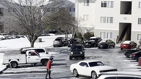 Good Samaritan Slides Across Icy Carpark