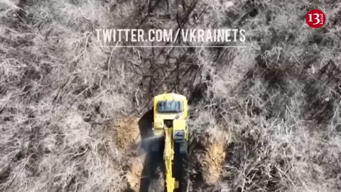 Ukrainian drone targets Russians digging a trench with an excavator