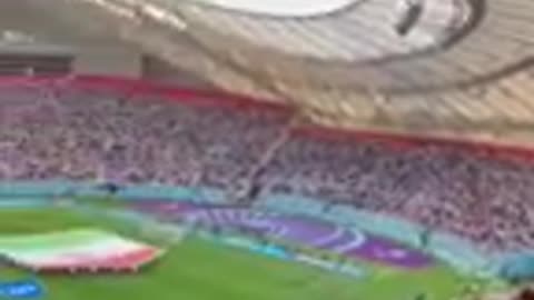 Iranian football supporters boo national anthem and players refuse to sing