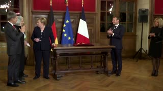Macron raises final toast to Merkel