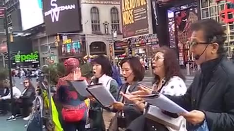 Singing hymns at 42nd Street and Broadway NY NY.