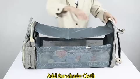 Large-capacity portable mommy bag - switchable baby folding bed form