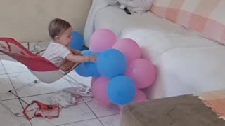 Baby Plays With Balloons