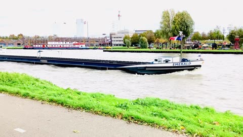 Boots passing on beautifull large water cannel.