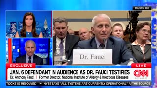 Fauci has a J6er make faces behind him during his testimony.