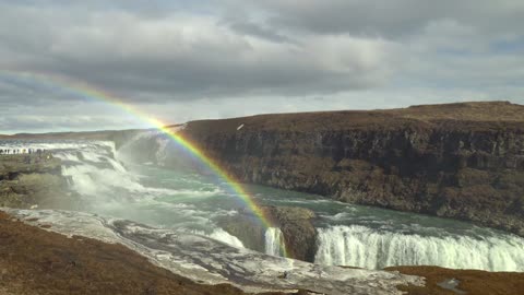 Combines a large river flowing through a rainbow