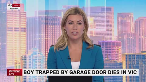 Boy trapped by garage door dies in Victoria