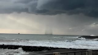 Waterspout spirals off Roman coast