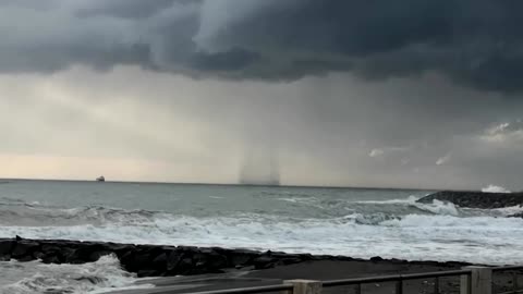 Waterspout spirals off Roman coast