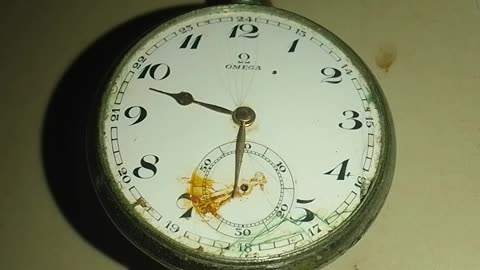 Close up the antique 1912 Swiss Omega Pocket Watch Silver, broken and dirty, 100 years old!