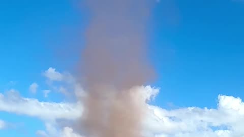 Person Capturing a Forming Dust Devil