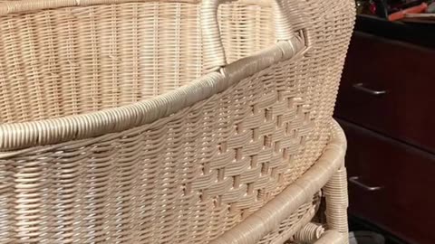 Rattan bassinet weaving.