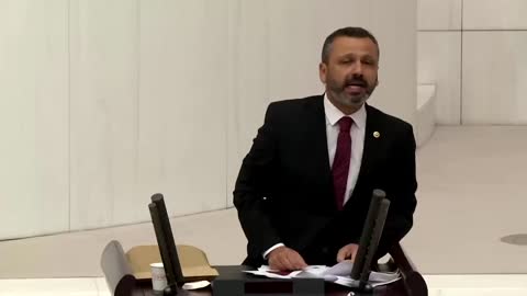 Turkish lawmaker smashes phone with hammer